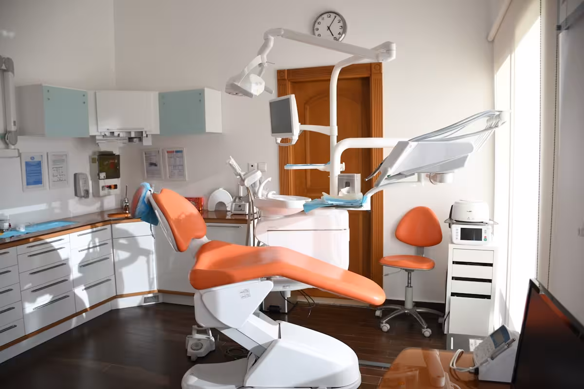 Dentist reviewing a digital smile plan on a tablet screen.